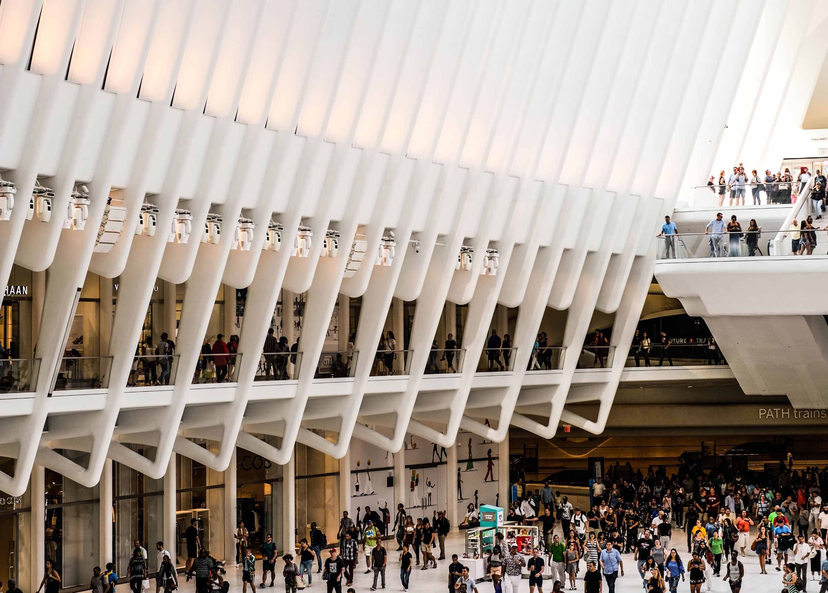 Large convention centre filled with people.